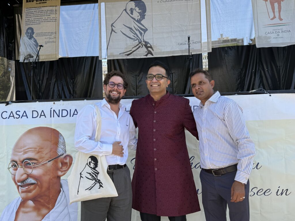 Guests and TLG Foundation team members in conversation at the community booth during Festival Gandhi 2026