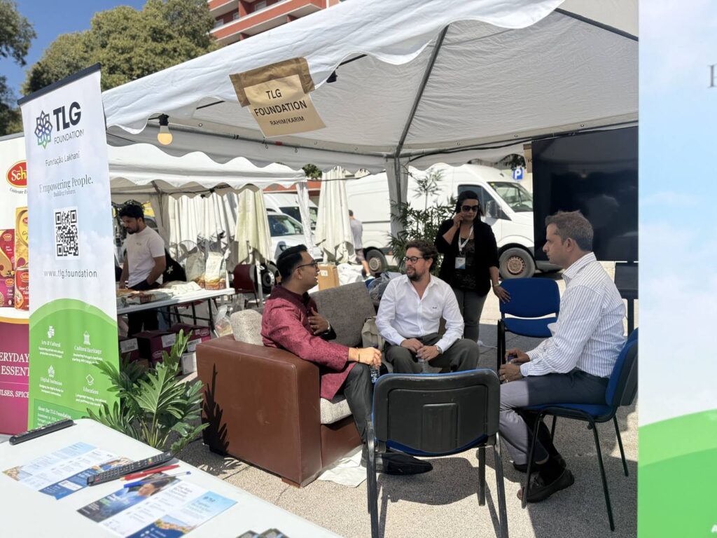 TLG Foundation team members in conversation at their community booth during Festival Gandhi 2026